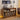 A pair of wooden record store display cabinets filled with vinyl records, styled in a cozy living room setting with a turntable, headphones, and warm string lights.