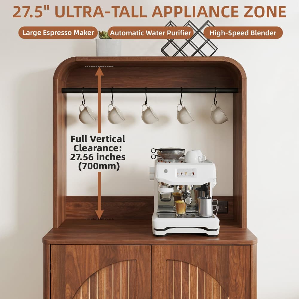A wooden appliance cabinet with a tall back panel, shown with a white espresso machine on the lower shelf and hanging mugs on the back rail. Text at the top reads '27.