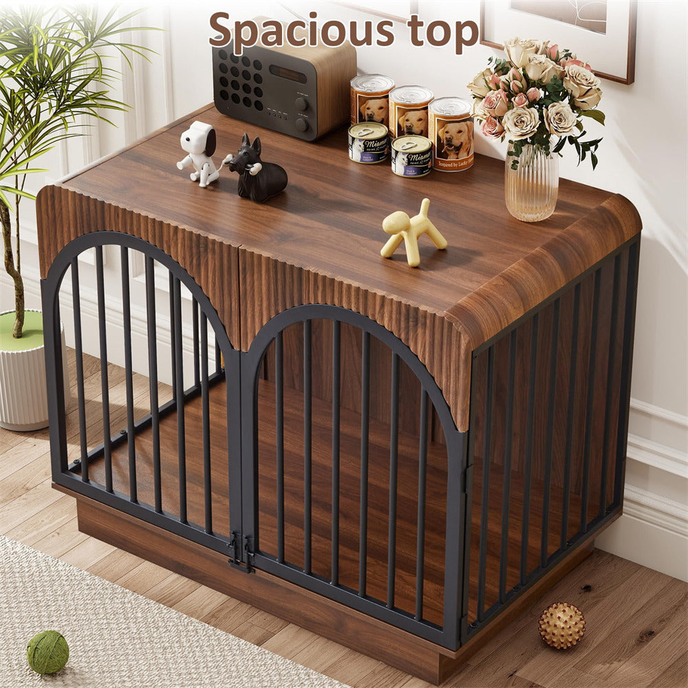 A wooden pet crate with black metal bars and a slatted top, shown in a styled room setting with decorative items on top. The image includes a text overlay reading 'Spacious top' in the upper portion.