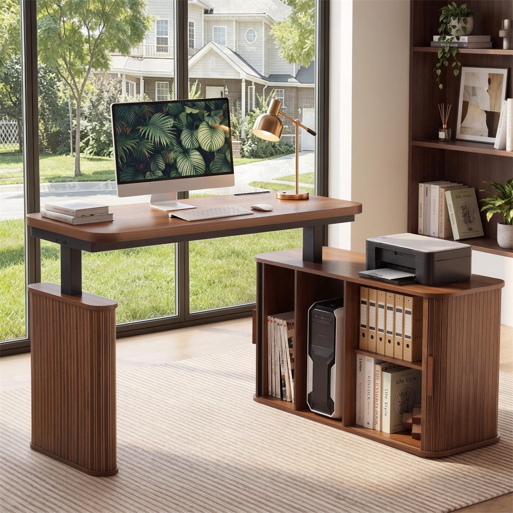 A modern wooden computer desk with a matching storage cabinet, styled in a bright home office setting with a computer, lamp, and books.