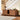 Wooden sideboard with decorative items in a home setting