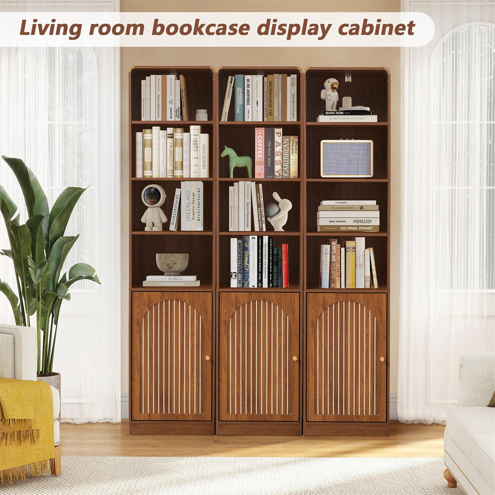 Wooden bookcase display cabinet in a living room setting with books and decor items.