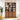 Wooden bookcase display cabinet in a living room setting with books and decor items.