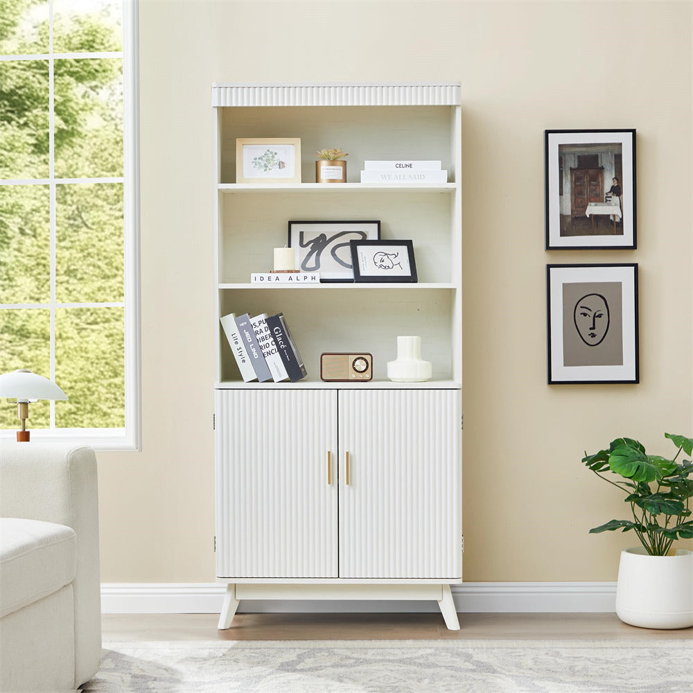 White bookshelf with decorative items in a living room setting