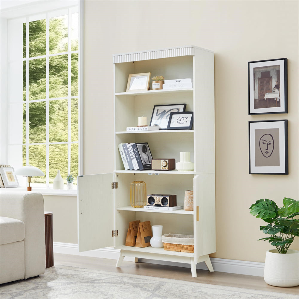 White bookshelf in a living room with decor items and a window in the background