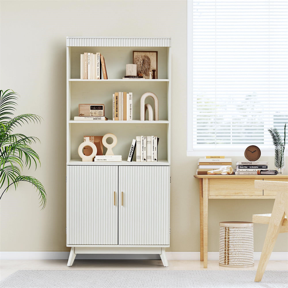 White bookshelf with decorative items in a room with a desk and plants.