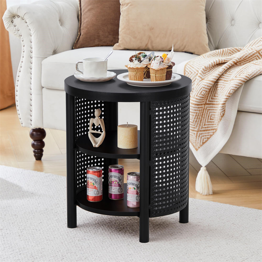 Black round side table with decorative items in a living room setting