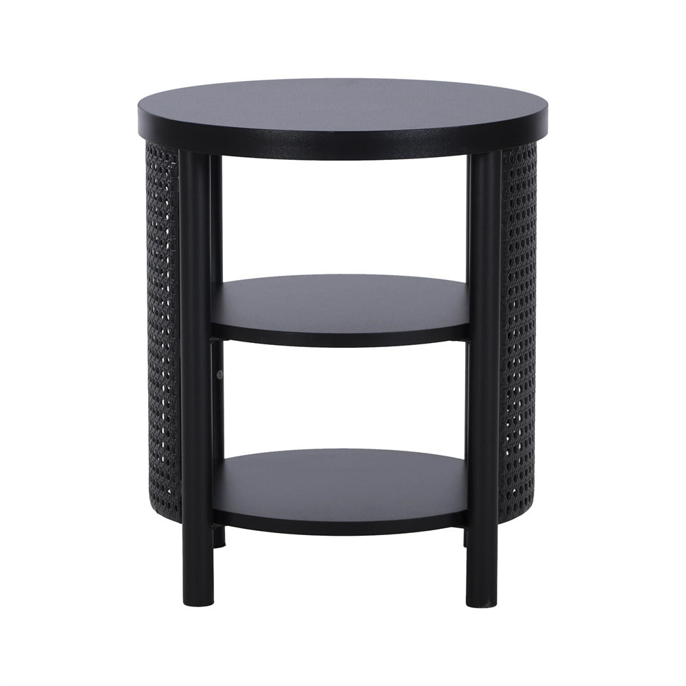 Round black side table with woven design on a white background