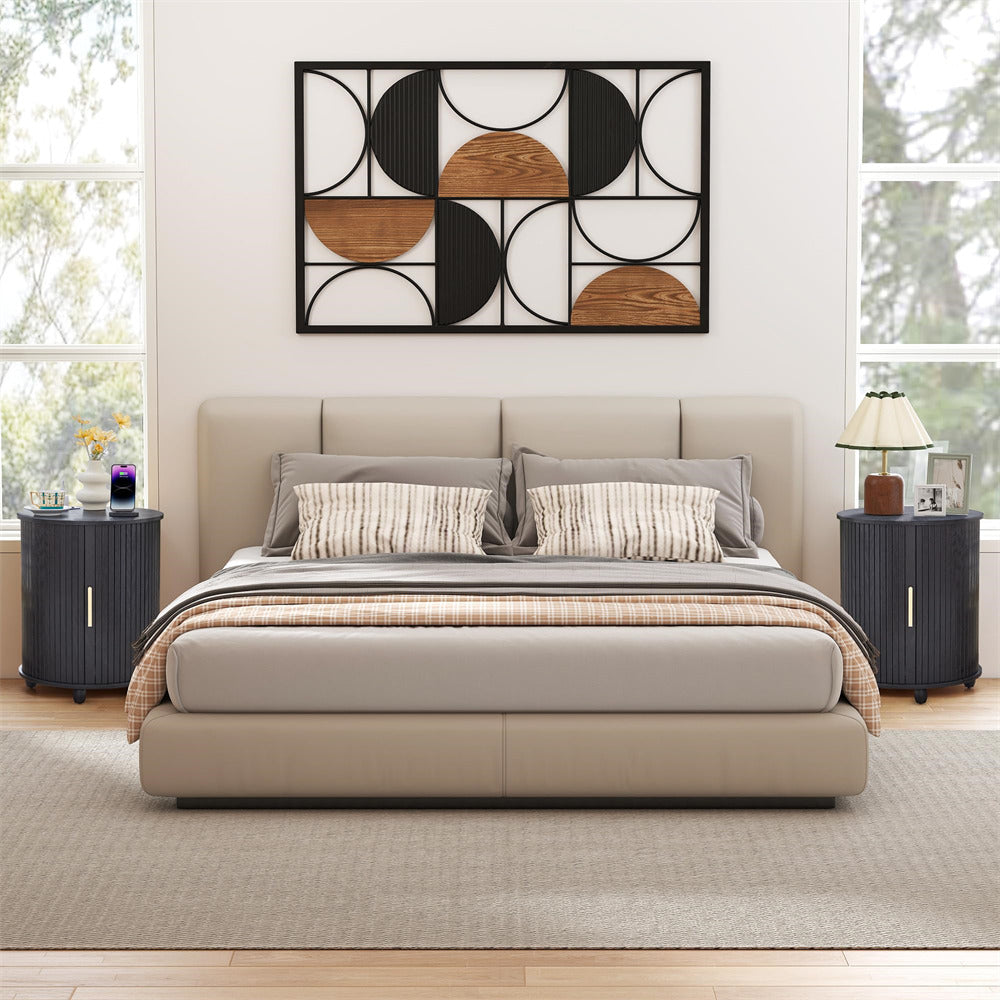 Modern bedroom with a bed, nightstands, and wall art.