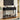 Black console table in a living room with decor items on shelves