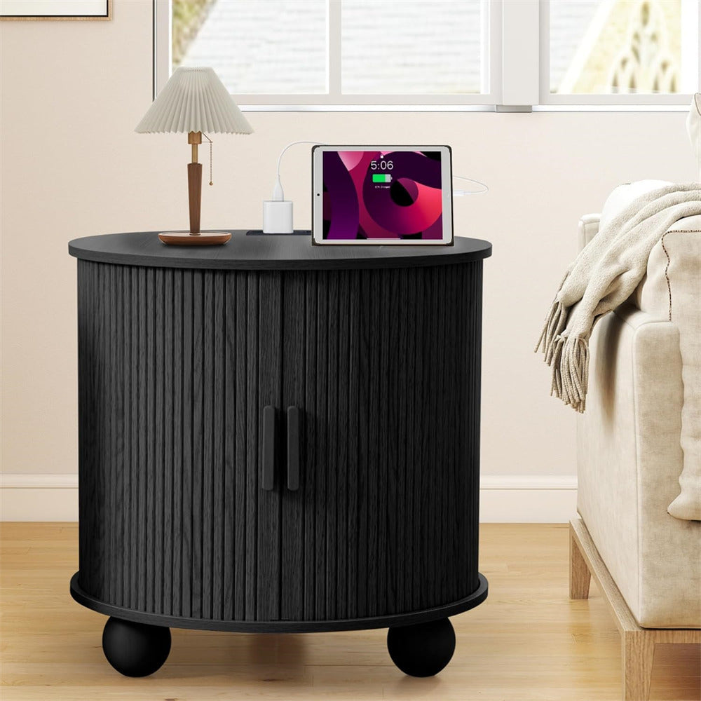 Black side table with wheels in a living room setting