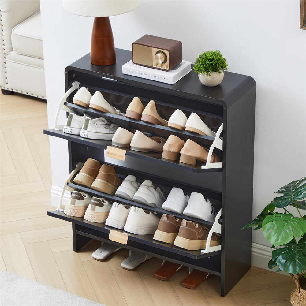 Black shoe rack with various shoes on a wooden floor in a room setting.