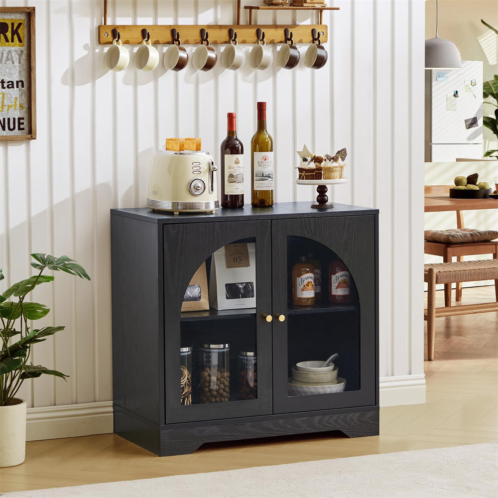 Black cabinet with glass doors displaying items in a room with a plant and dining table.