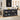 Black storage cabinet with glass doors in a kitchen setting, featuring appliances and decor items.