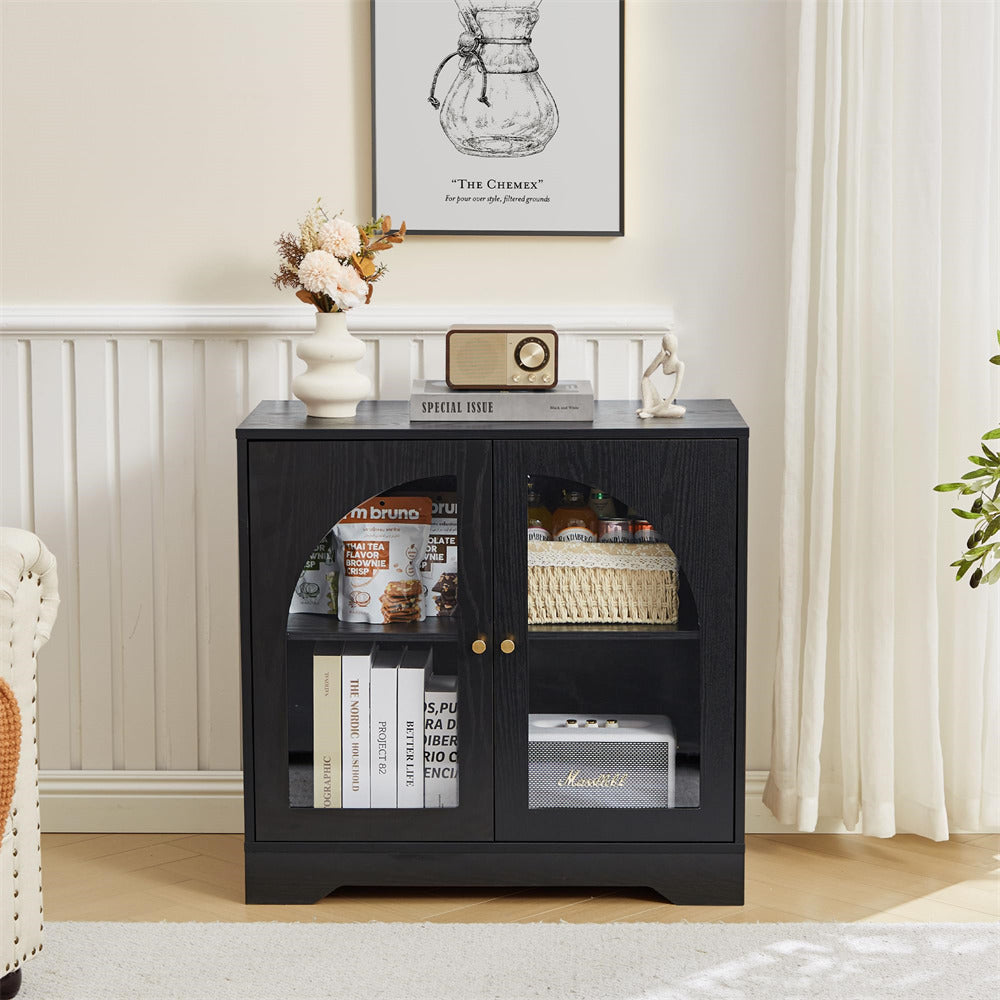 Black glass-fronted cabinet with decorative items in a living room setting.