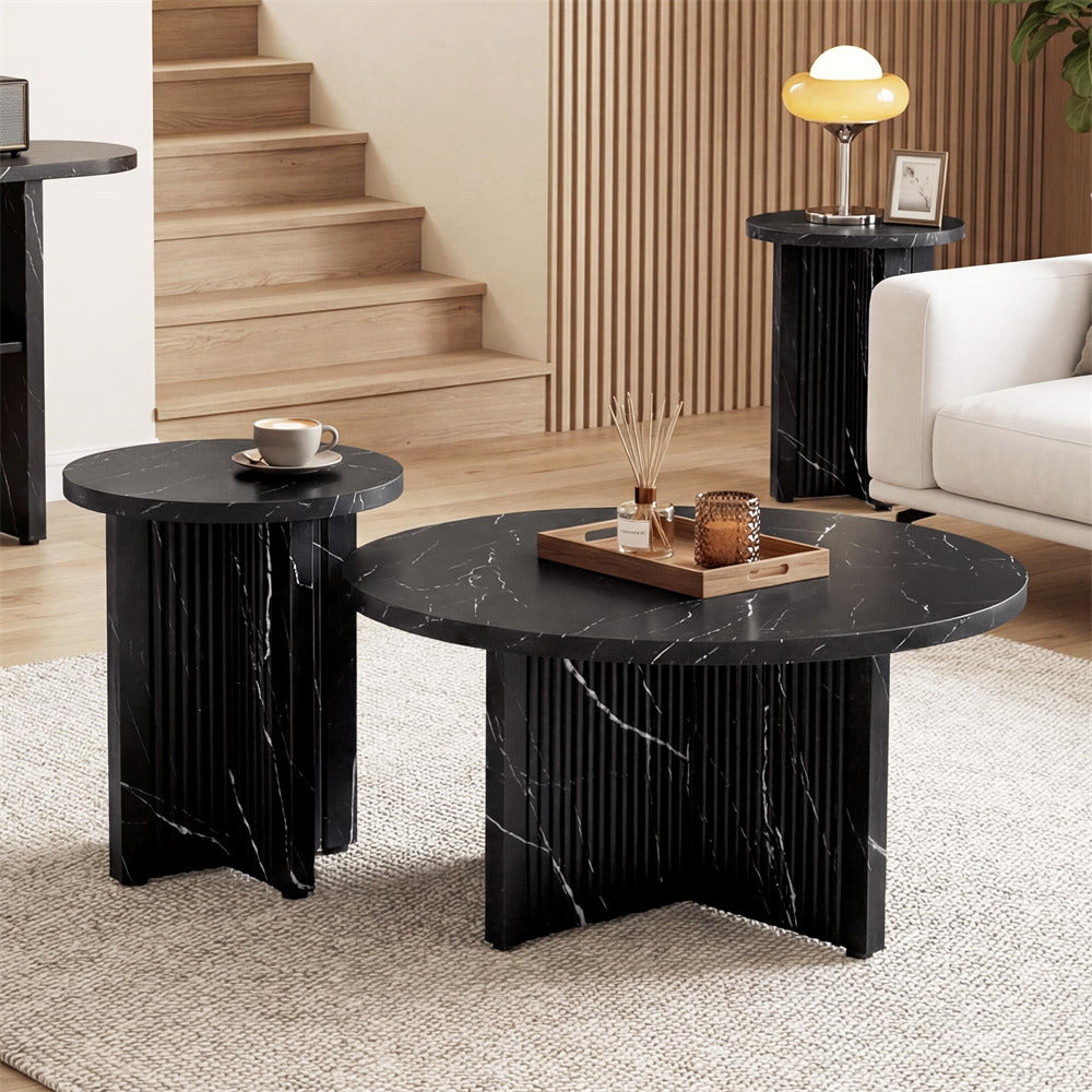 Black marble coffee table with side tables in a living room setting.
