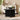 Black marble dining table in a stylish room with decor elements.
