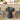 Black round table with decorative items in a kitchen setting
