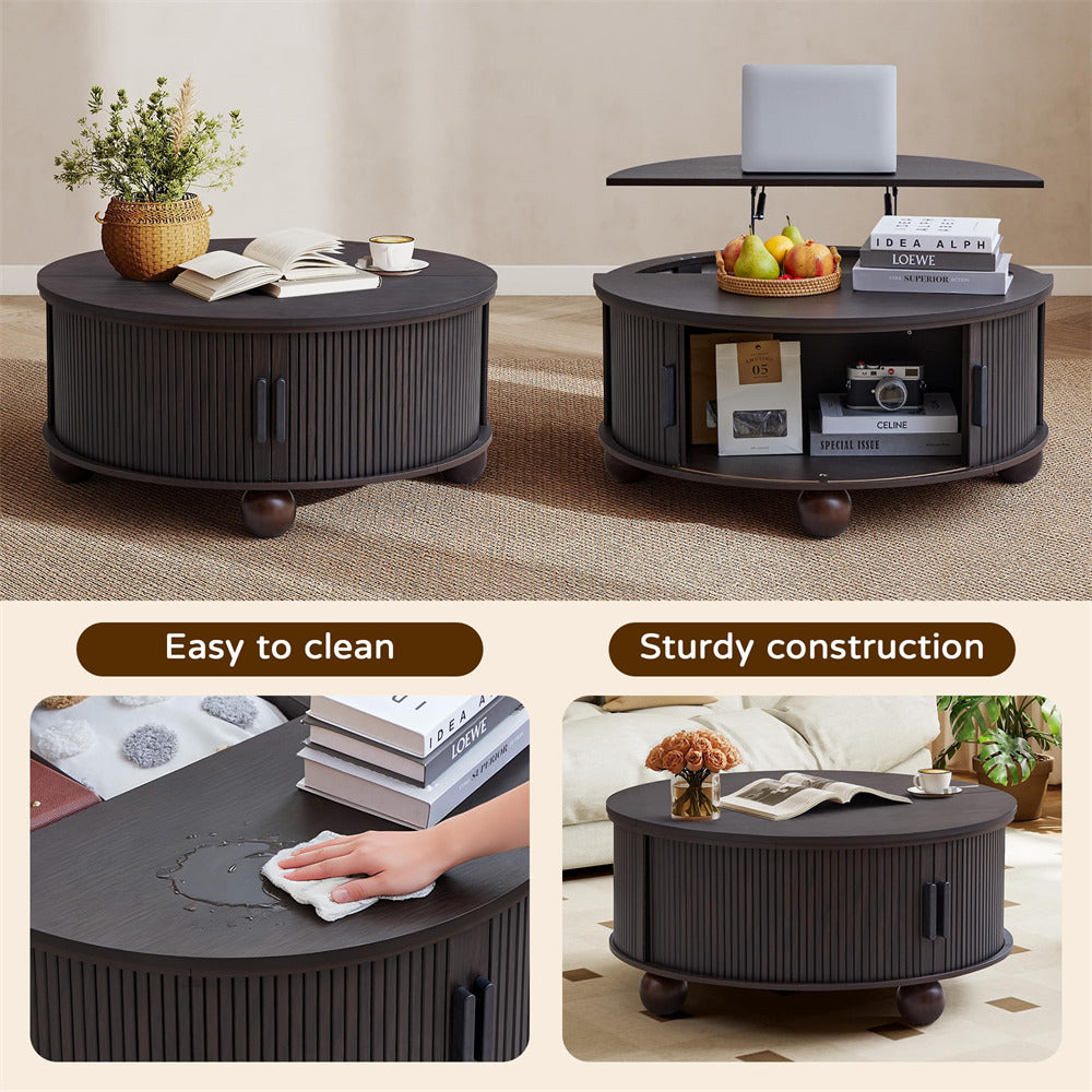Round black coffee table with various items on top, shown in a living room setting.