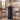 Black 39.37" H Wood Fluted Round Bar Table with Base & Metal Ring Footrest