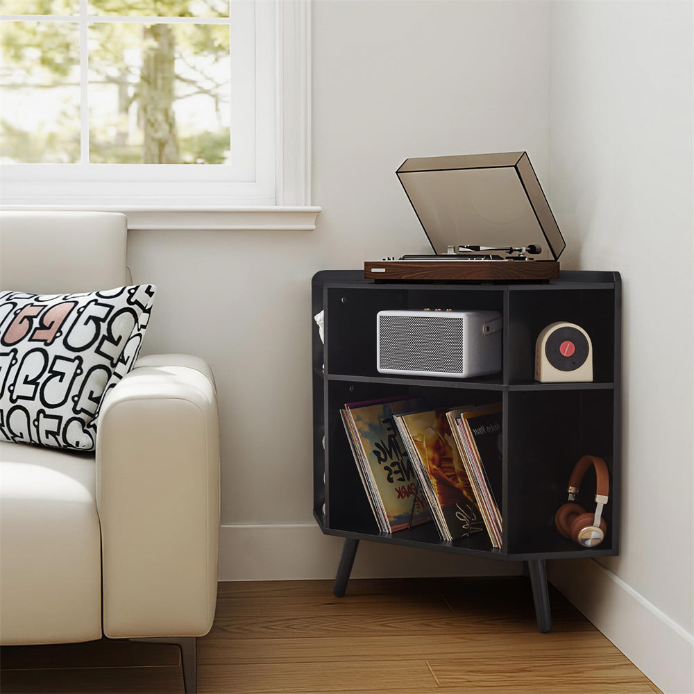 Black record player cabinet with vinyl records and a radio in a living room setting.