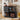 Black storage unit with vinyl records, speakers, and a record player in a room.