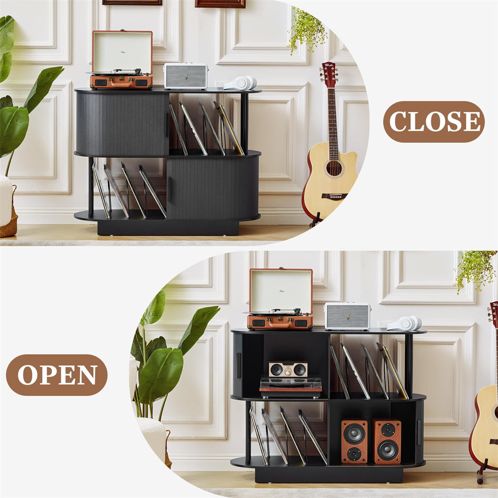 Black record player stand with open and closed compartments, displaying vinyl records and a guitar in a room setting.