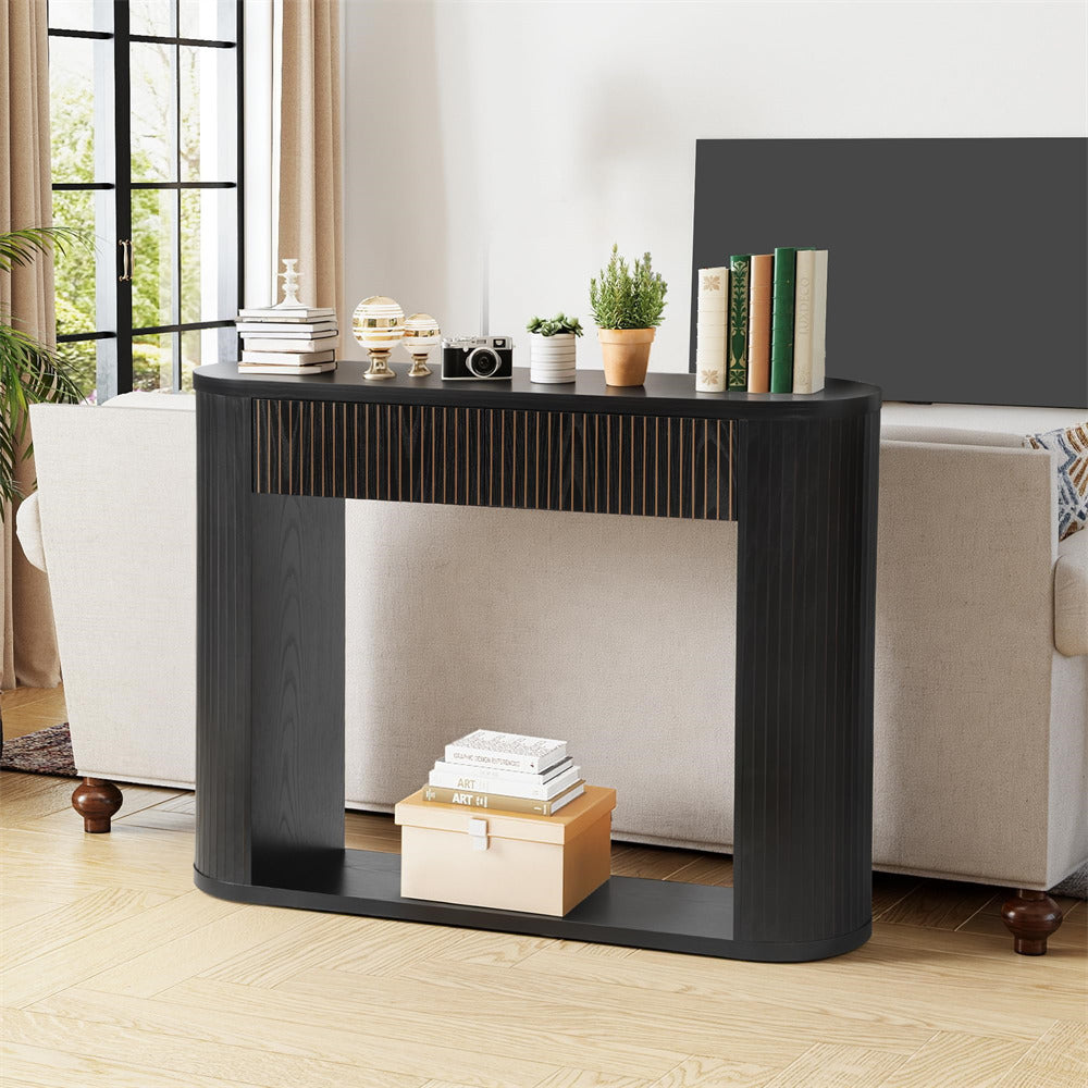 Black console table with decorative items in a living room setting