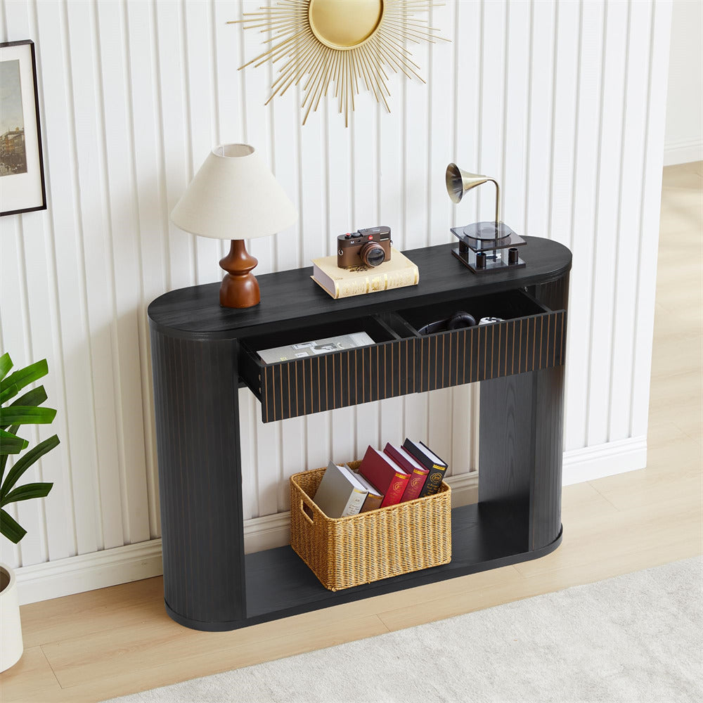 Black console table with decorative items in a room setting