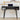 Black desk with oval curved desktop, sliding fluted door storage, and metal legs on a light wooden floor.