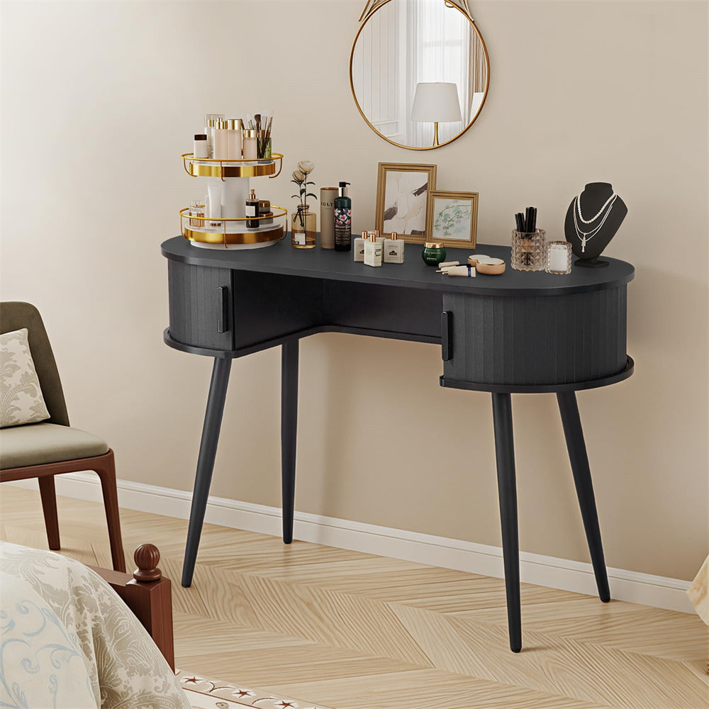 Black vanity desk with various items in a bedroom setting