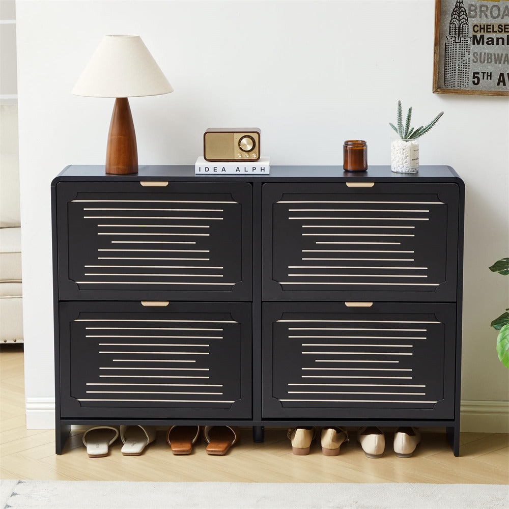 Black shoe cabinet  with decorative items on top in a room setting