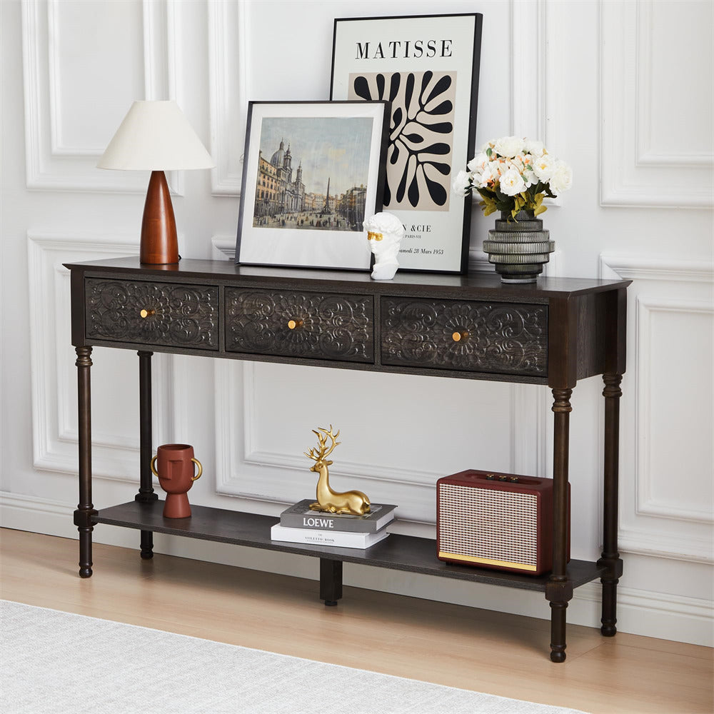 Decorative console table with various items against a white wall