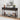 Decorative console table with various items against a white wall