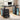 Black computer desk with storage drawers and CPU stand in a home office setting.