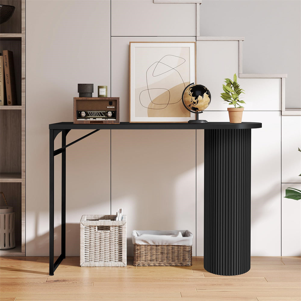 Black console table with decorative items in a room setting
