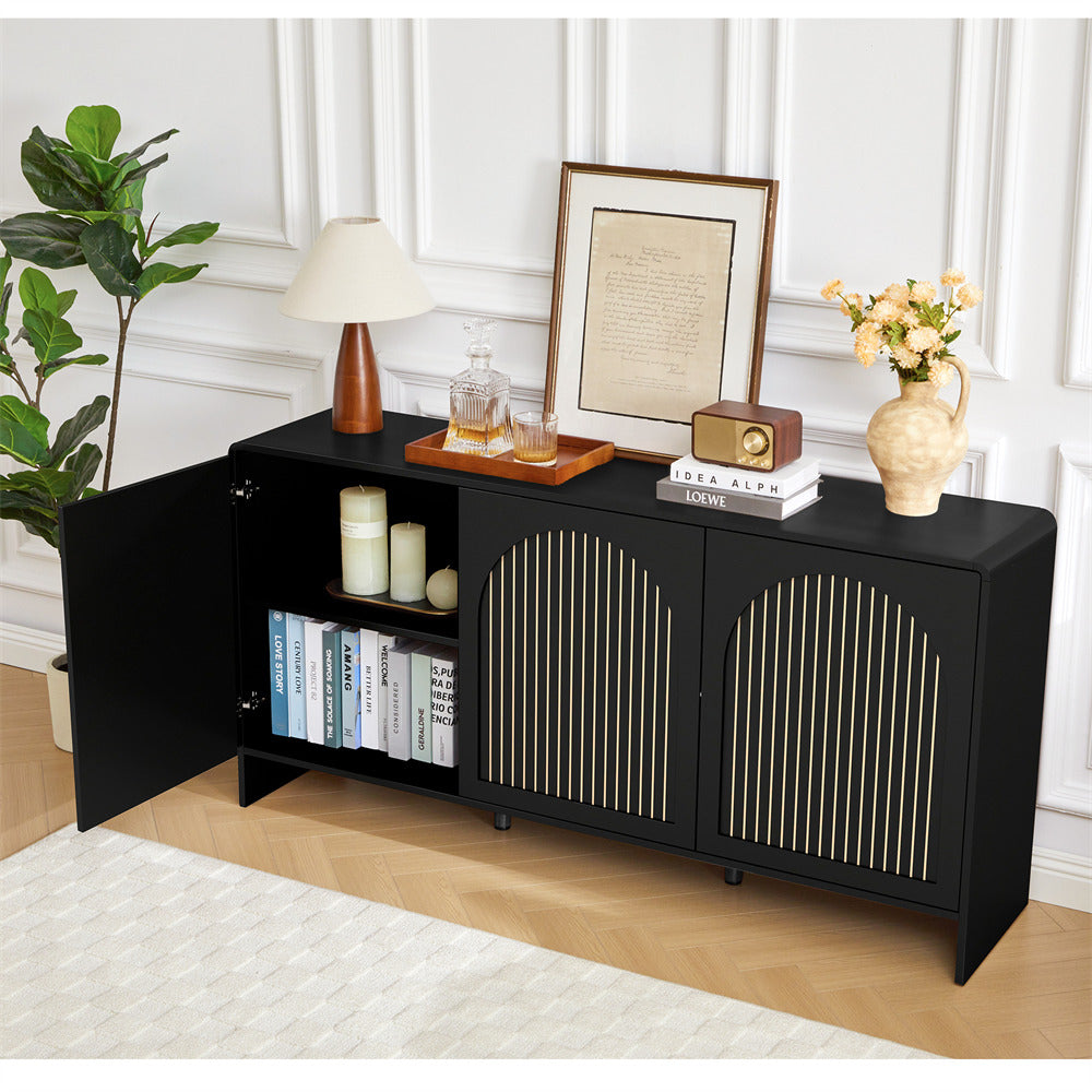 Black sideboard with decorative items in a room with a plant and framed picture.