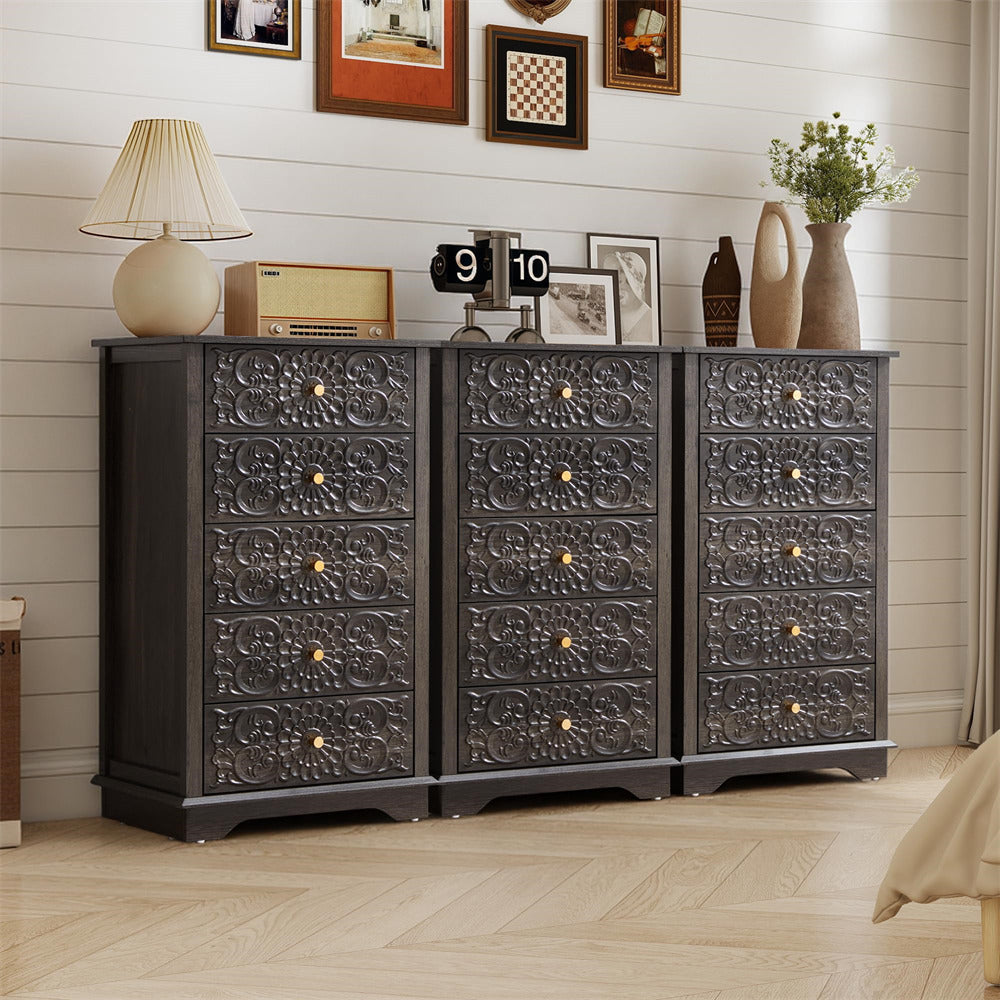 Decorative chest of drawers with intricate carvings in a room setting.
