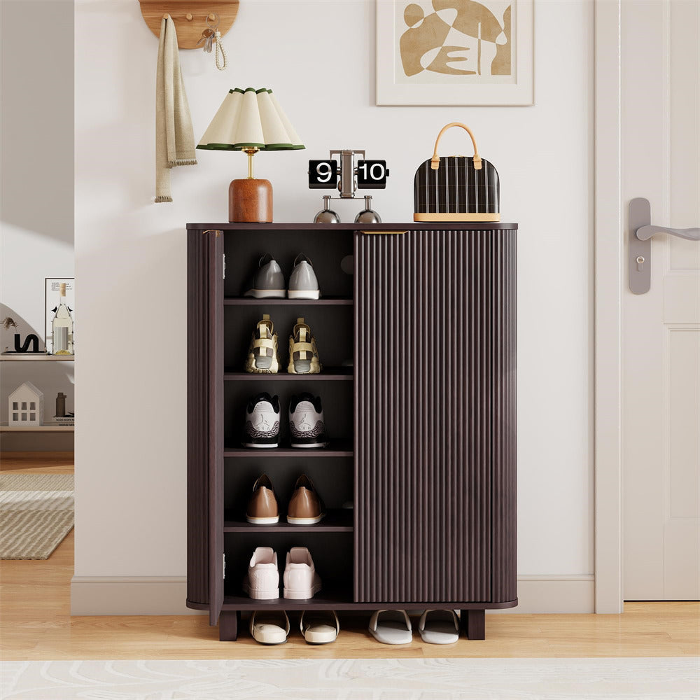 Brown 5 Tier shoe cabinet with shoes on a wooden floor in a room.