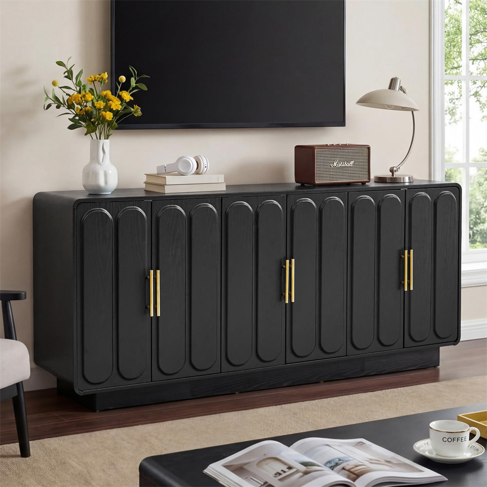 Black sideboard with decorative items in a living room setting