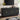 Black sideboard with decorative items in a living room setting