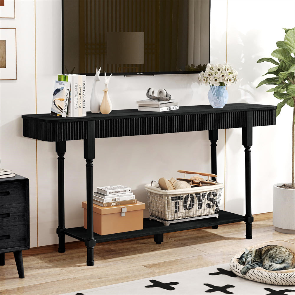 Black console table in a living room with decor items and a TV above.