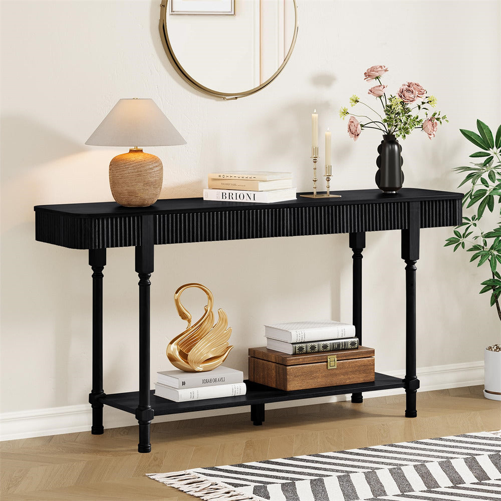 Black console table with decorative items in a room setting