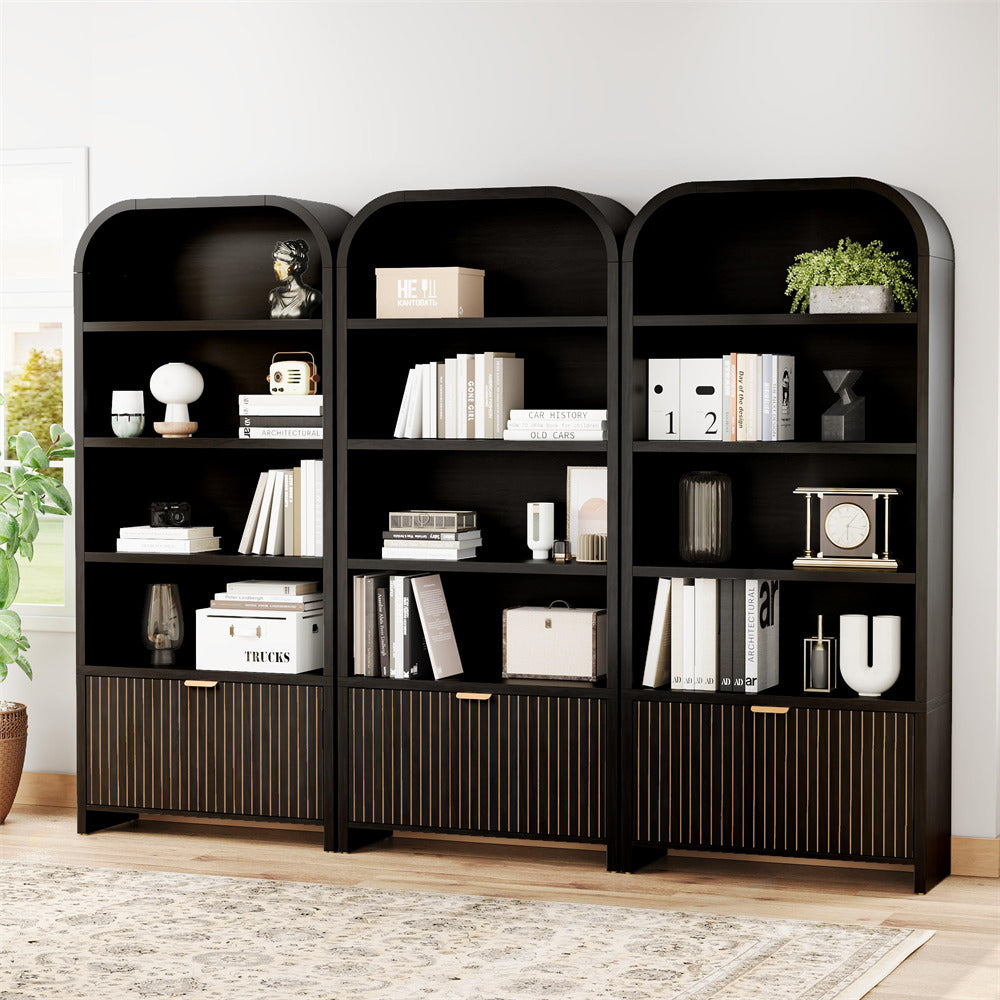 Black bookshelves with decorative items in a room setting