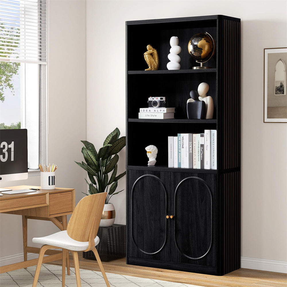 Black bookshelf with decorative items in a room with a desk and window.