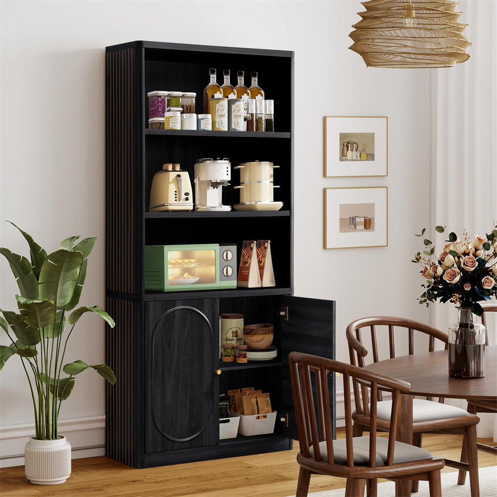 Black bookshelf with kitchen appliances in a room with a dining table and chairs.