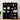 Black bookshelf with decorative items against a white wall