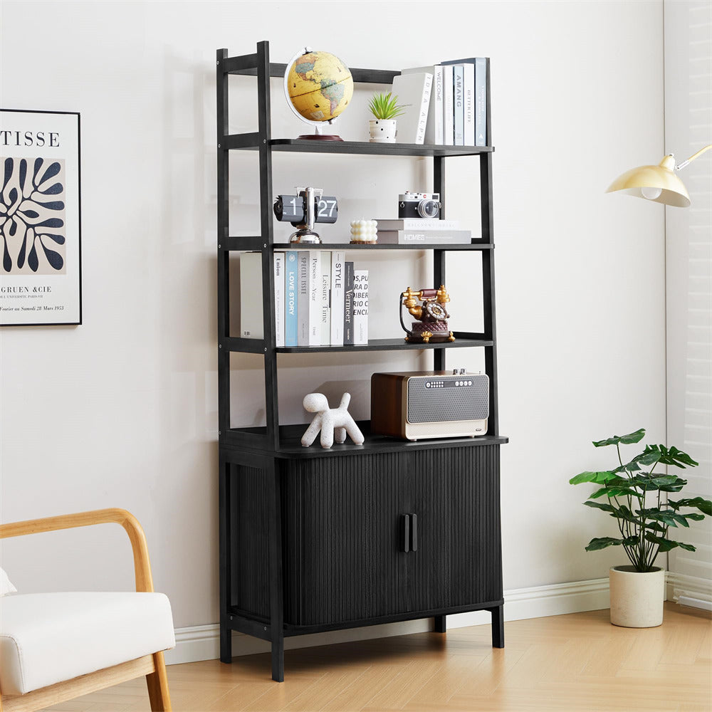 Black bookshelf with decorative items in a room with a chair and plant.
