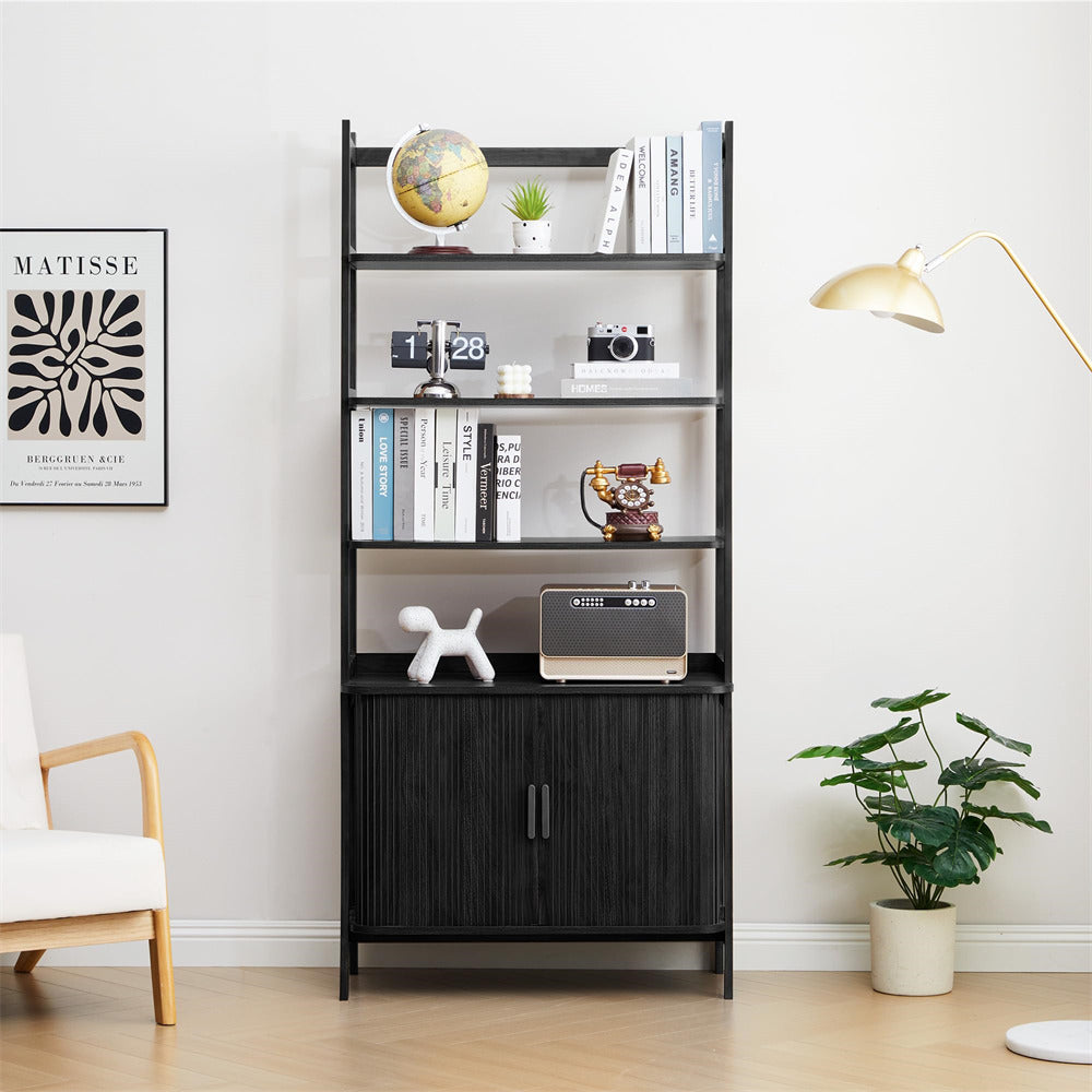 Black bookshelf with decorative items in a room with a chair, plant, and lamp.