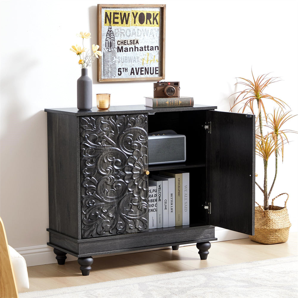 Black decorative cabinet with open door, books, and decor items on a light-colored floor.